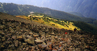 Painted orange arrows on rocks in scree field of Mt. Outram